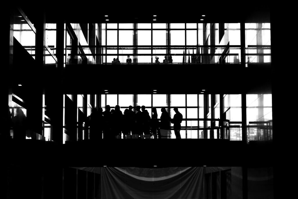 Silhouettes across the floors of a modern office