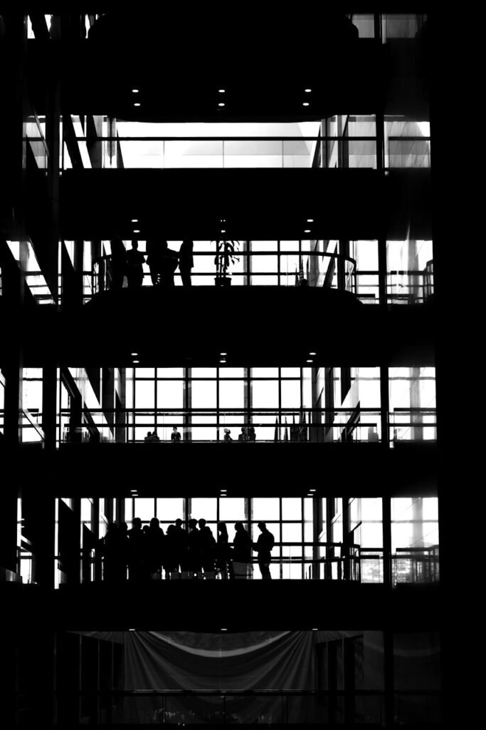 Silhouettes across the floors of a modern office