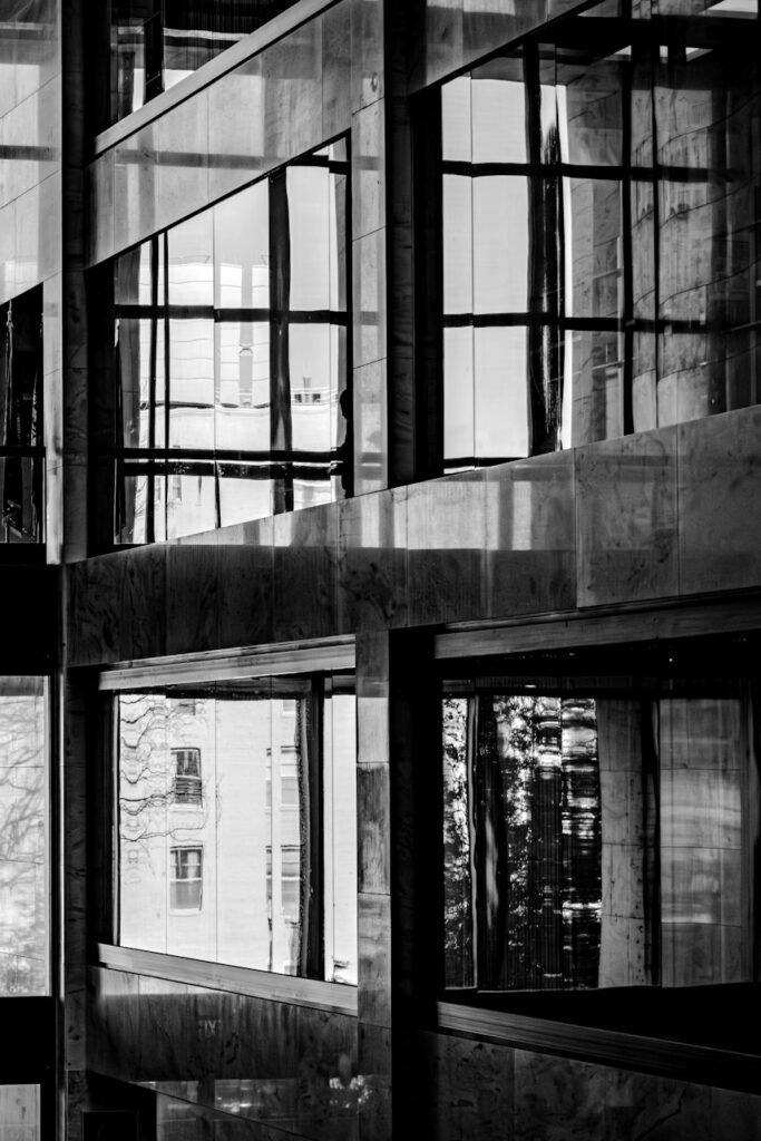 A person crossing a walkway inside a modern building