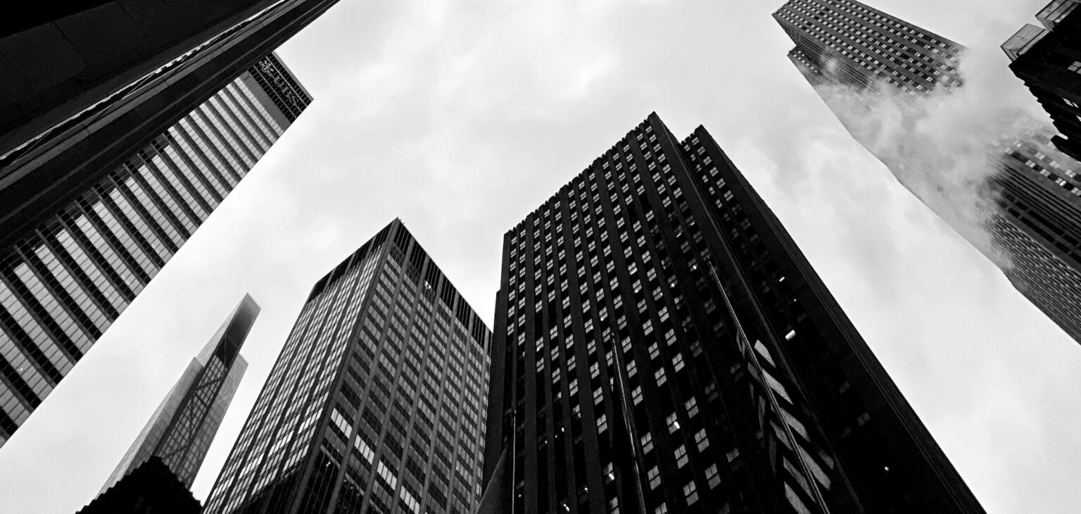 Looking up at glass skyscrapers